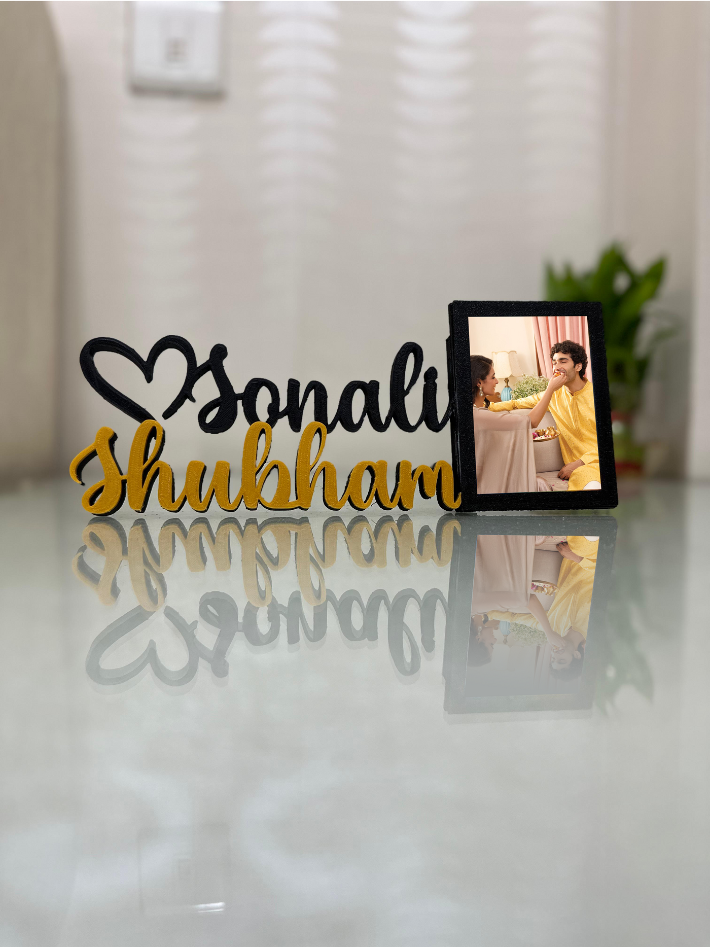 Black & gold couple name with frame